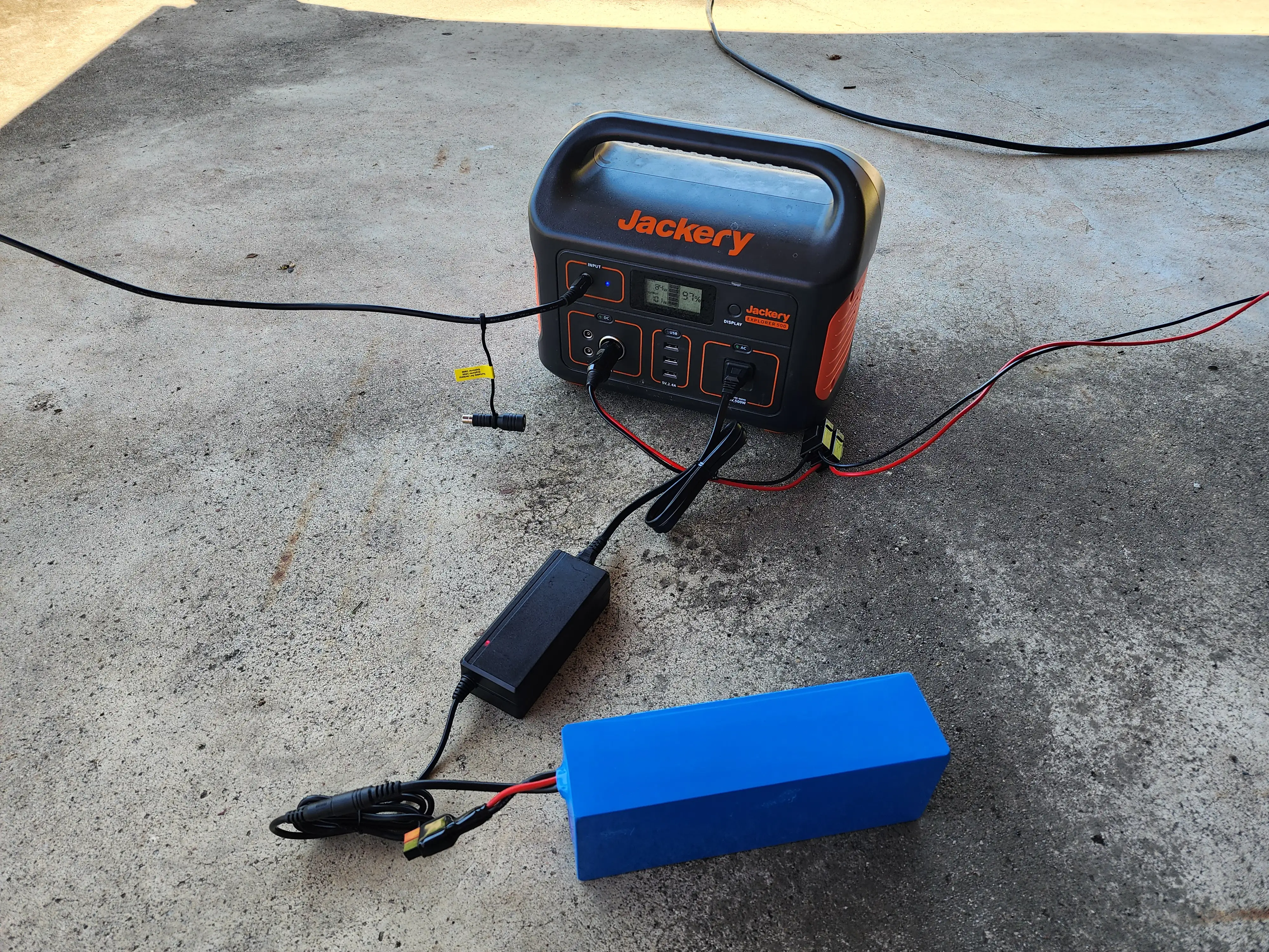 Jackery being powered by the solar panel, while also charging another spare battery Jackery being powered by the solar panel, while also charging another spare battery